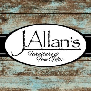 a white oval with black text on a blue wood surface
